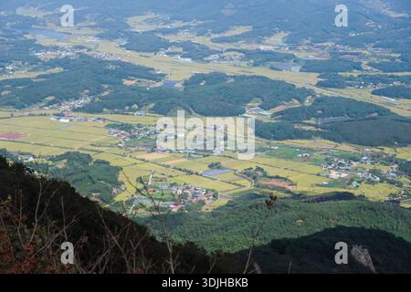 Panoramic hiking view from Oseosan mountain overlooking valleys and layered mountain ridges in South Korea. Stock Photo