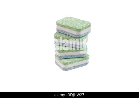 Colorful dishwasher detergent tablets in a row on white background closeup showing texture cleaning concept and household hygiene. Stock Photo