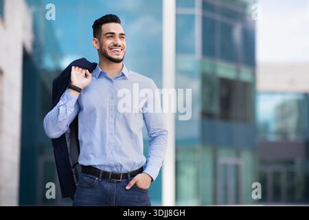 Happy muslim entrepreneur going home from job Stock Photo
