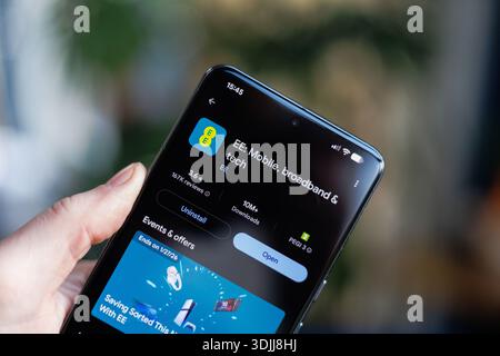 EE App on mobile phone in hand Stock Photo