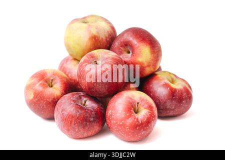 Fresh red apples stacked on white background. Ripe autumn fruit closeup. Healthy food ingredient composition. Natural apples isolated with copy space. Stock Photo