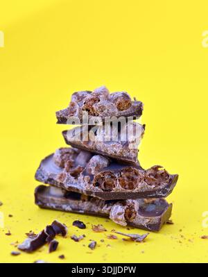 Aero Bubbly Milk Chocolate on yellow background. Stock Photo