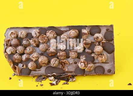 Aero Bubbly Milk Chocolate on yellow background. Stock Photo