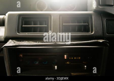 close up of air ventilation and AC control panel on dashboard old car Stock Photo