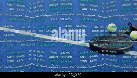 Showing black earbud case connected earbud two pale balls on blue mat, data overlay, copy space Stock Photo
