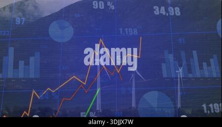 Displaying analytics dashboard overlaying wind turbines in valley, showing colored line charts Stock Photo