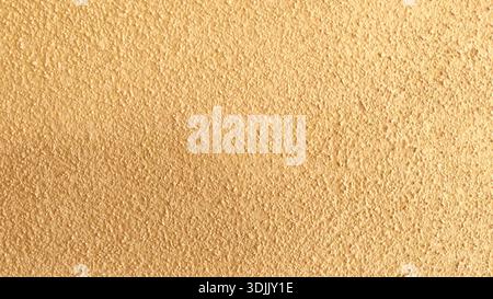 Golden-Yellow Granular Wall Texture for Architectural Background Use Stock Photo