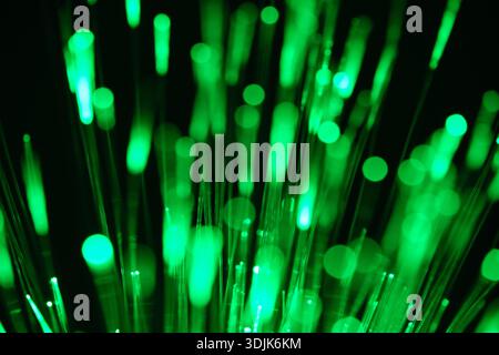 Bunch of optical fibres dinamic flying from deep on technology background Stock Photo