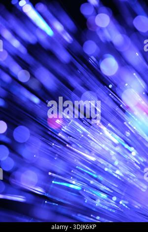 Optical fibres dinamic flying from deep on technology abstract background. Stock Photo
