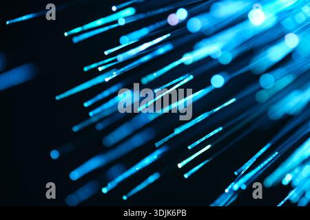 Fiber optical network cable in blue light. Close up macro Stock Photo