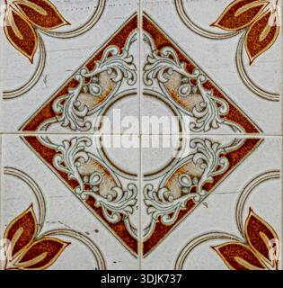 A detailed view of a decorative tile found in Setenil, Spain. The tile features intricate patterns with both floral and geometric designs, capturing l Stock Photo