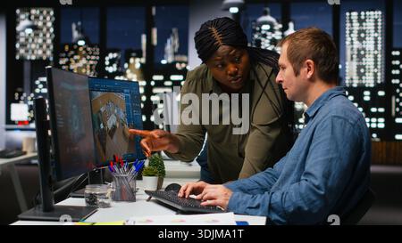 Diverse team of engineers using artificial intelligence to design a floor plan, working together with neural networks and computer aided apartment layout on architectural software. Camera B. Stock Photo