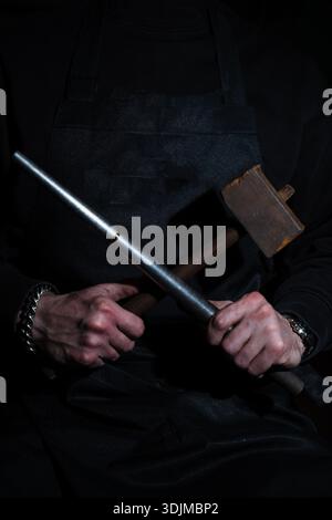 Ring shaped and refined by hammering in jewelry workshop Stock Photo