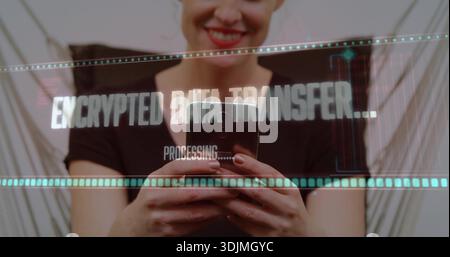 Smiling woman using smartphone, displaying ENCRYPTED DATA TRANSFER holo UI, black short-sleeve top Stock Photo