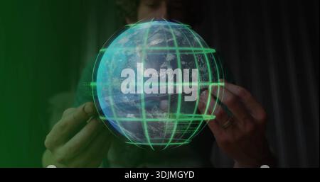 Manipulating ringed hands holding hologram Earth globe with green grid, glass, camouflage jacket Stock Photo