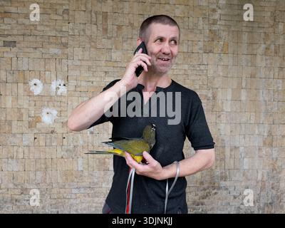 A senior man is taking a mobile phone Stock Photo