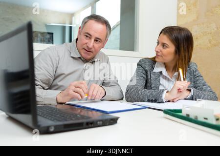 two architects designers discussing at office Stock Photo