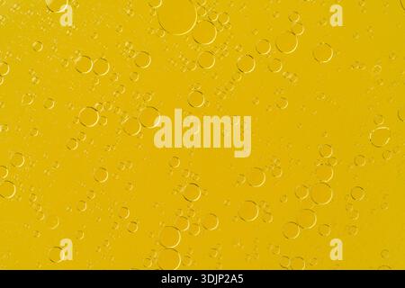 Golden liquid with bubbles abstract macro background Stock Photo