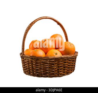 Bunch of ripe fresh orange fruits in a wicker basket isolated on white background. Stock Photo