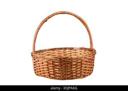 Wicker or rattan basket with handle, isolated on white background. Stock Photo