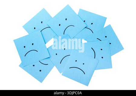 Blue sticky notes with sad face drawing isolated on white background with clipping path. Top view. Design element. Stock Photo