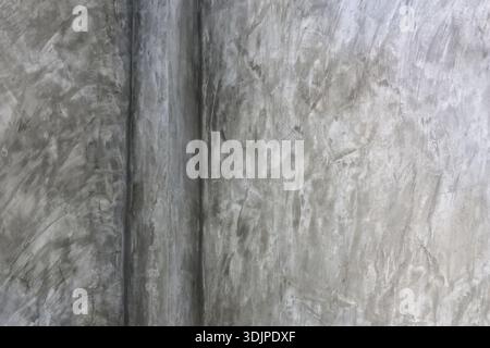 Abstract textured grey concrete wall background with polished cement surface pattern showing rough industrial grunge detail for minimal loft architect Stock Photo
