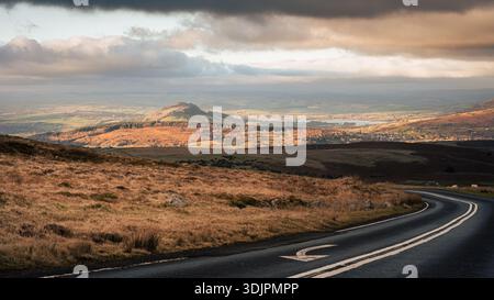 View north on Llangynidr Road at golden hour with road and road markings Stock Photo