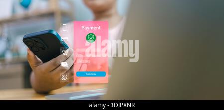 Hand holding smartphone with secure payment interface and confirmation button. Concept of mobile banking, digital transaction safety, and online shopp Stock Photo