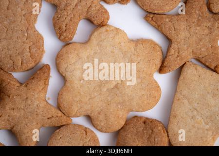 Studio shot of simple flower shaped cookie on white backdrop, High quality studio image featuring minimal design flower cookie against clean white bac Stock Photo