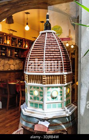 Creative cork‑stopper sculpture of Brunelleschi’s Dome displayed outside a restaurant in the historic center of Florence, Italy Stock Photo