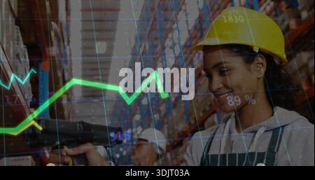 Scanning worker wearing yellow hard hat, apron using scanner in warehouse, data overlay, copy space Stock Photo