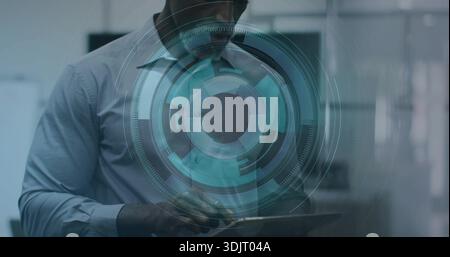 Working man wearing light shirt, glasses, using tablet behind glass with holographic UI in office Stock Photo