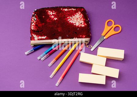 Still life stationery colored felt pen in pencil case on purple background, creative copy space for text, concept gadget free digital detox Stock Photo
