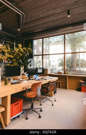 Interior of empty modern design office with computers on desk Stock Photo
