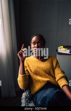 Female tech professional discussing while working in office Stock Photo