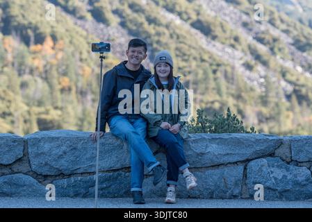 Couple taking a selfie at an overlook in Yosemite National Park, California, USA. Stock Photo