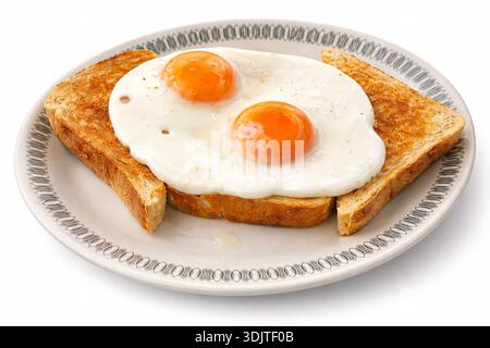 Fried eggs on toast - white background  *Original photograph by the contributor, digitally modified using AI tools  Stock Photo
