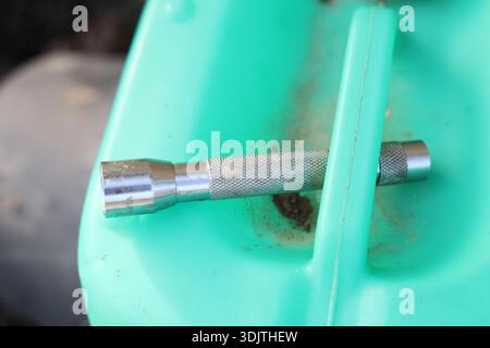 A small metallic used and dirty flashlight Stock Photo