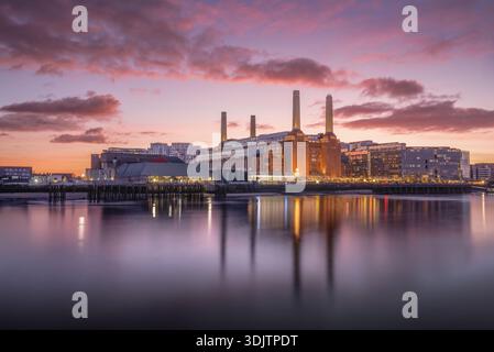 The iconic Battersea Power Station taken during a beautiful sunset with a slack tide allowing for glorious reflections Stock Photo