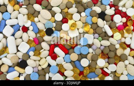 Various colors pills texture background drugs pattern Stock Photo