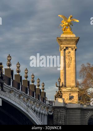 Gilded statue of one of the Fames next to the Pont Alexandre III bridge - Paris, France Stock Photo