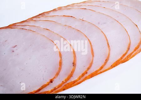 Visual depiction of sliced roasted meat for packaging. Arrangement of thinly sliced cooked meat for commercial food presentation showcasing packaging Stock Photo