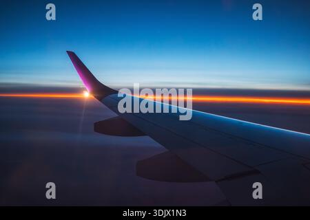Aerial view from the plane over blue hour Stock Photo