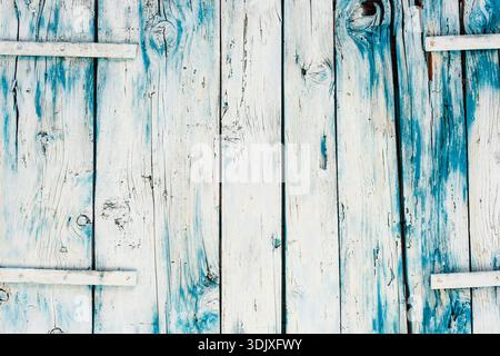 Weathered wooden boards painted white and blue forming rustic textured background. Stock Photo