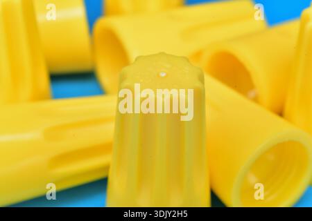 Close up of yellow twist on wire connector marette for copper conductor Stock Photo