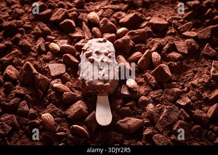 Sweet almond ice cream on chocolate bars and cocoa powder. Almond ice cream with chocolate and vanilla. Stock Photo