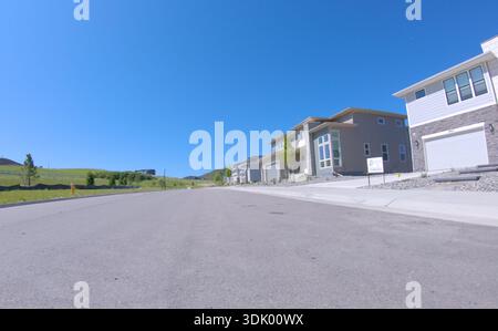New home construction along clean driveway Stock Photo