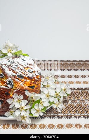Traditional Easter bread decorated with fresh spring blossoms and dusted with powdered sugar Stock Photo