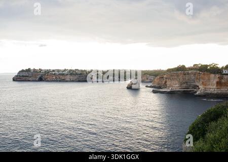 Picturesque cliffs and rocks over the sea on Mallorca island in Spain. Seascape from the viewing point near Cala Santanyi bay. Stock Photo