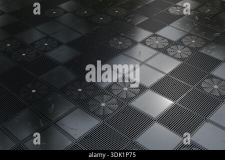 Angled view of a dark industrial floor composed of metal grid panels and solid square plates, showing repetition, wear marks, and a modern technical s Stock Photo